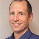 A professional headshot of Dr. Gerald Zavorksy.
